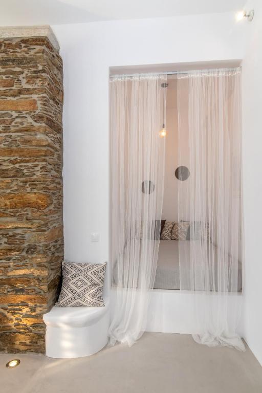 Posteľ alebo postele v izbe v ubytovaní Livadi house Tinos