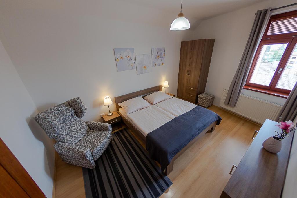Postel nebo postele na pokoji v ubytování Penzion Apartmány Resident