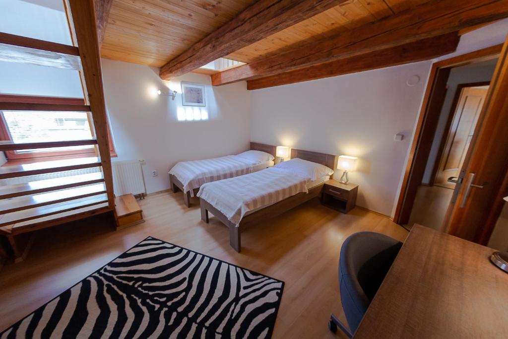 Postel nebo postele na pokoji v ubytování Penzion Apartmány Resident