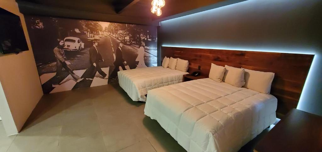 Postel nebo postele na pokoji v ubytování HOTEL RIO RITA