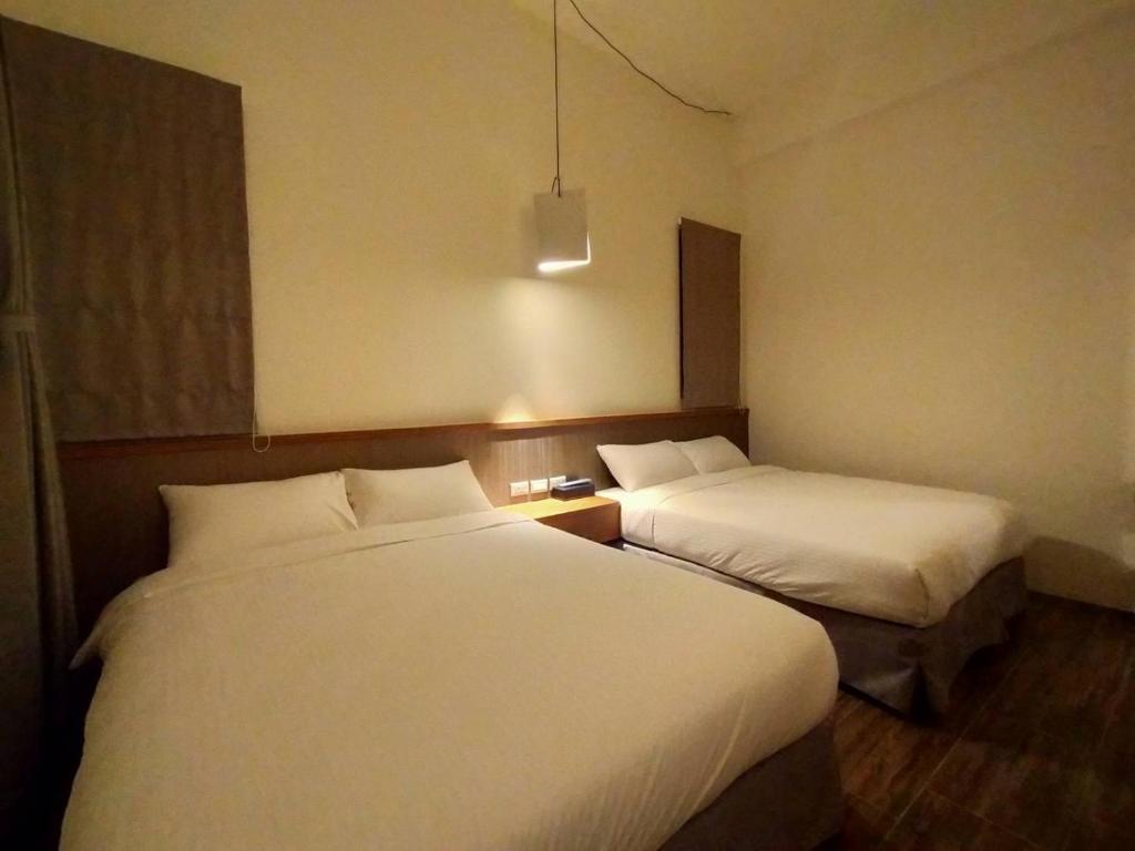 Postel nebo postele na pokoji v ubytování Wang yuan B&B