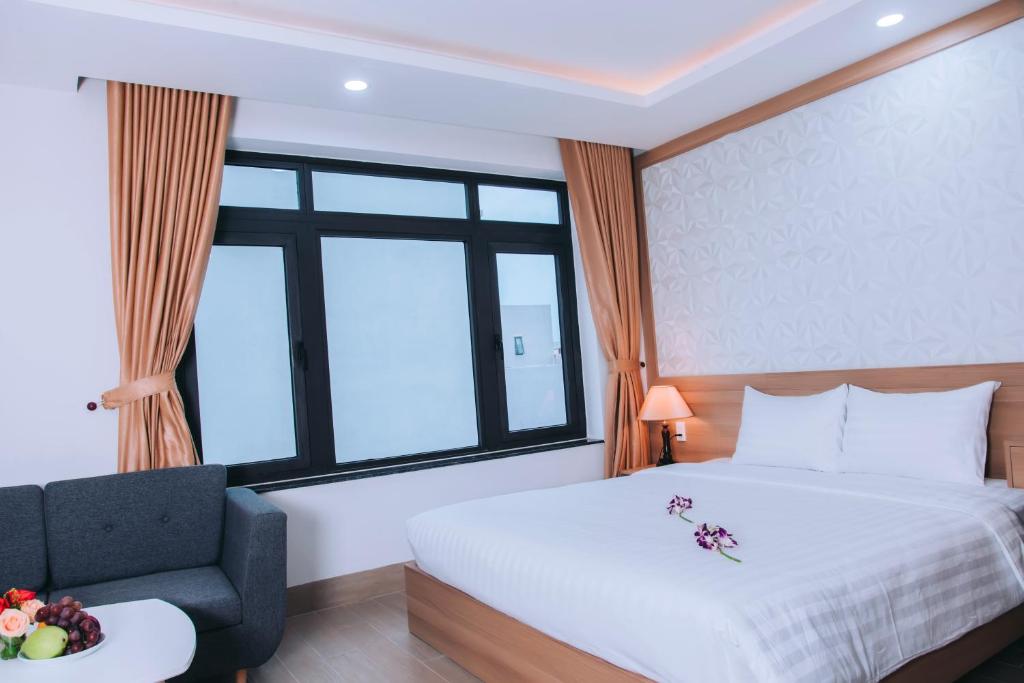 Postel nebo postele na pokoji v ubytování An Dương Hotel & Apartment