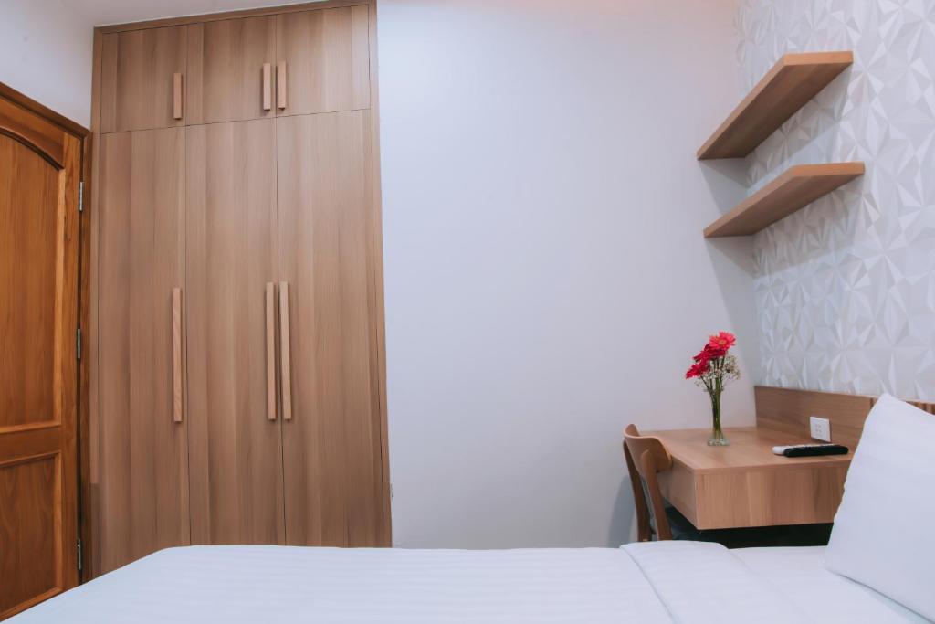 Postel nebo postele na pokoji v ubytování An Dương Hotel & Apartment