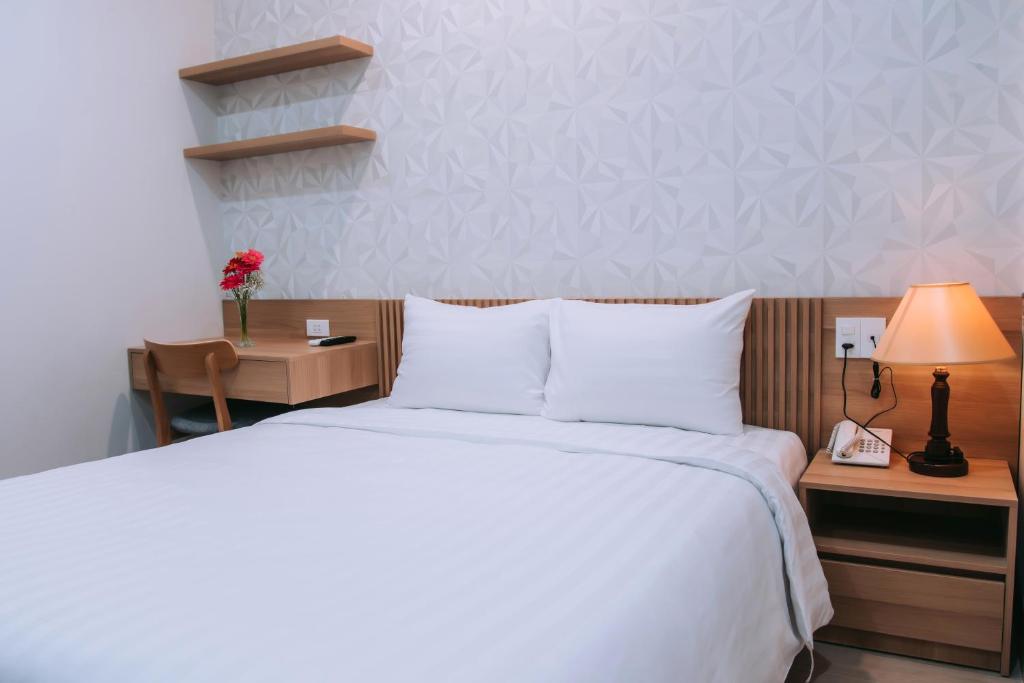 Postel nebo postele na pokoji v ubytování An Dương Hotel & Apartment