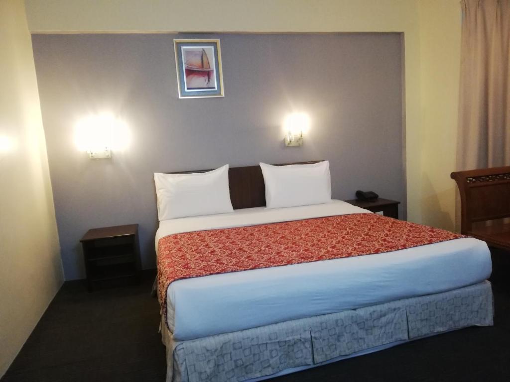 Postel nebo postele na pokoji v ubytování Hotel Damai