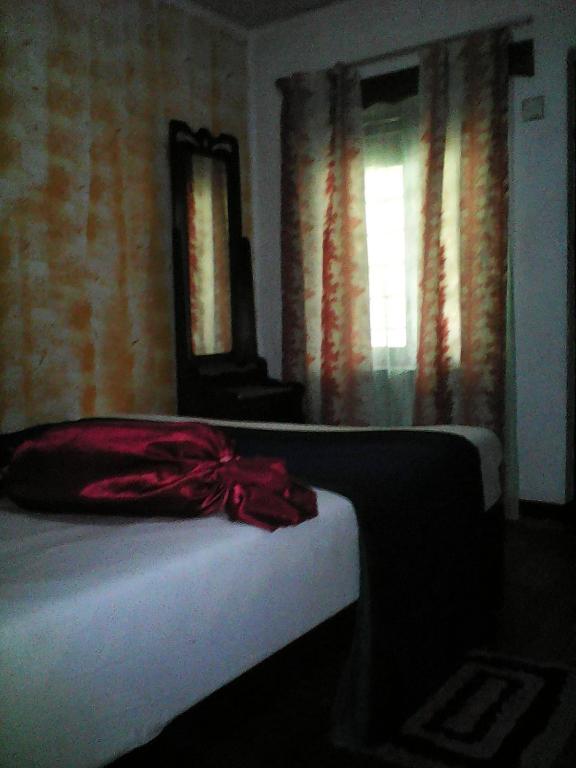 Postel nebo postele na pokoji v ubytování Lotus Inn Tourist Resort