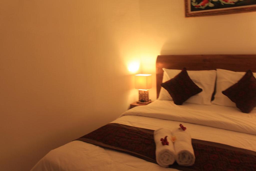Postel nebo postele na pokoji v ubytování Intan Guest House