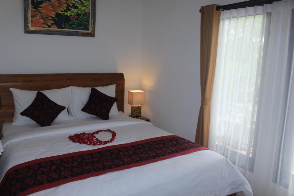 Postel nebo postele na pokoji v ubytování Intan Guest House