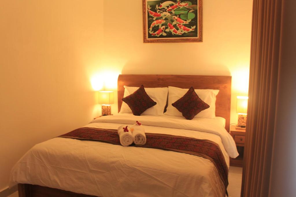 Postel nebo postele na pokoji v ubytování Intan Guest House