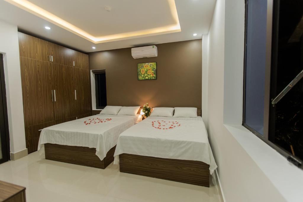 Giường trong phòng chung tại Bamboo Green Hotel