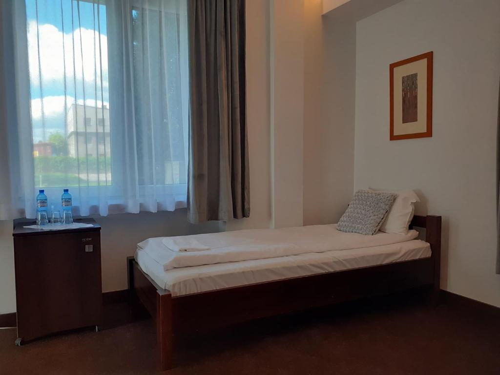 Кровать или кровати в номере Hotel Olecki