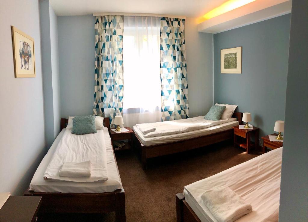 Кровать или кровати в номере Hotel Olecki