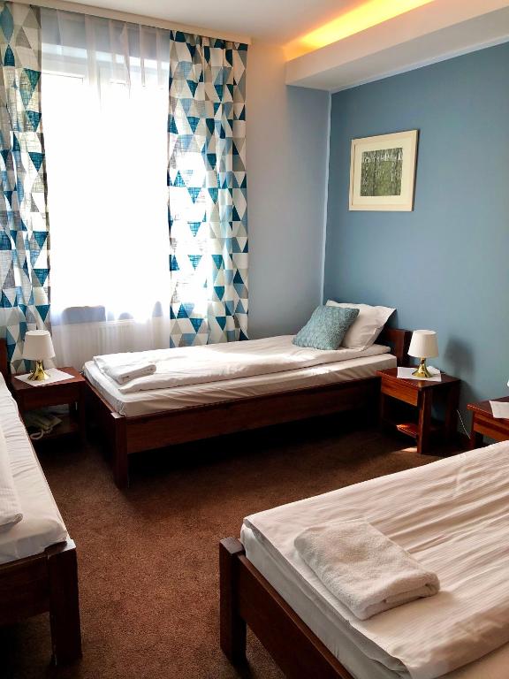 Кровать или кровати в номере Hotel Olecki