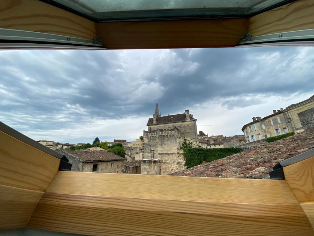 a view of a castle from the roof of a building at Logis des Jurats in Saint-Émilion