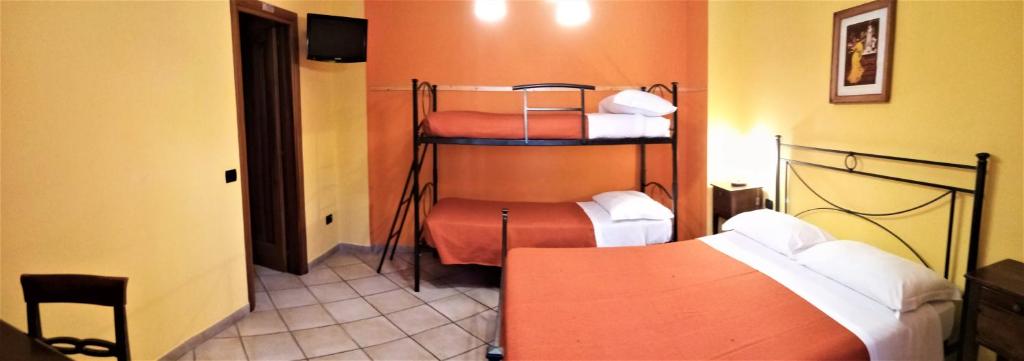 Postel nebo postele na pokoji v ubytování Hotel Pace