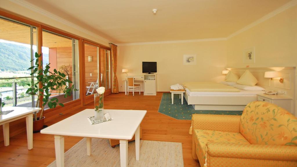 Postel nebo postele na pokoji v ubytování Hotel Olympia