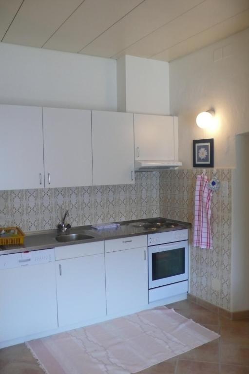 Kuchyň nebo kuchyňský kout v ubytování Apartments Posta al Lago