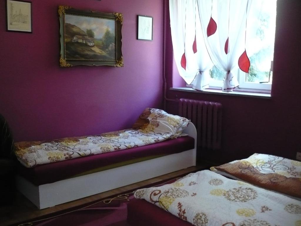 Posteľ alebo postele v izbe v ubytovaní Pokoje gościnne u Andrzeja