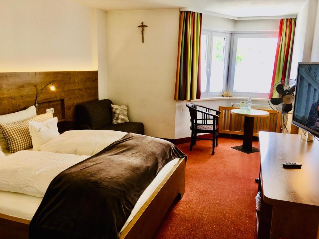 Postel nebo postele na pokoji v ubytování Isar Hotel