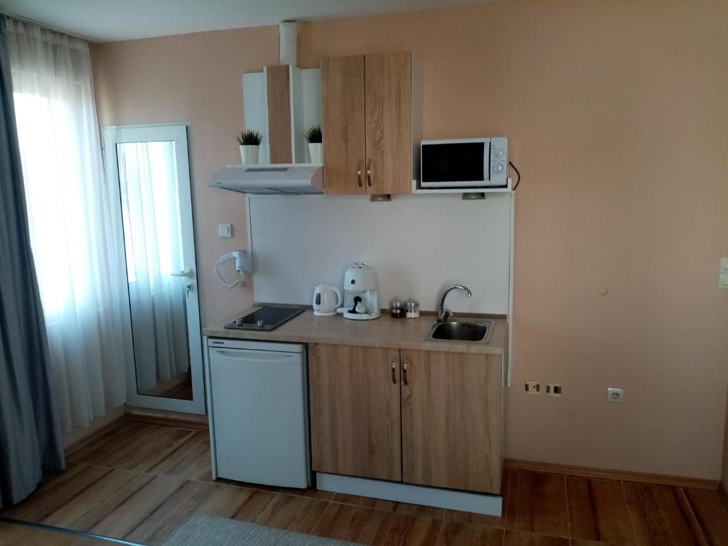 Kuchyň nebo kuchyňský kout v ubytování Benita Inn apartments