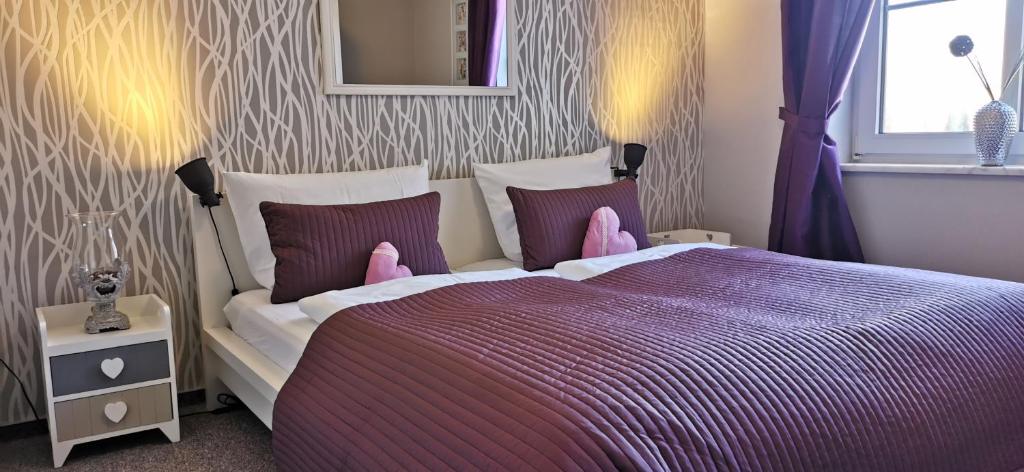 Postel nebo postele na pokoji v ubytování Apartments mit Flair