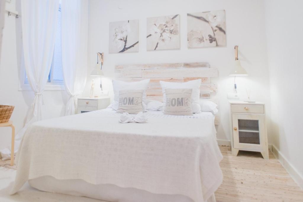 Postel nebo postele na pokoji v ubytování Hostal Vidamia