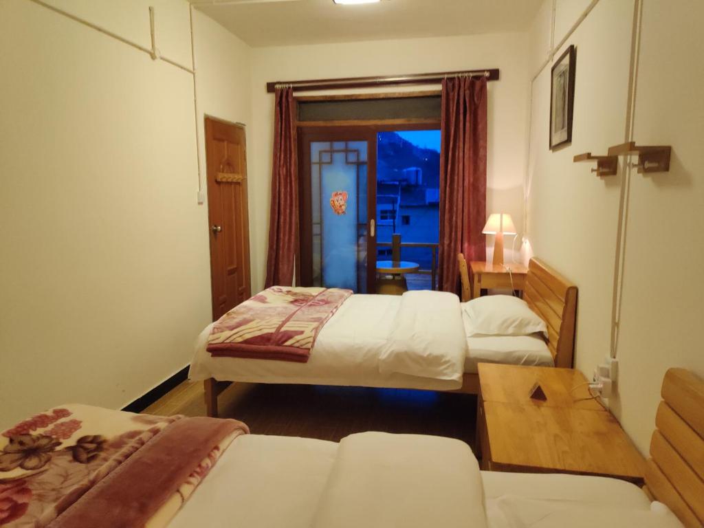 Postel nebo postele na pokoji v ubytování 多依湾客栈Havre de paix DuoYiWan