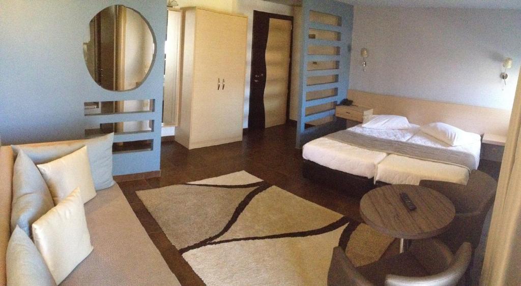 Postel nebo postele na pokoji v ubytování Hotel Ifigenia