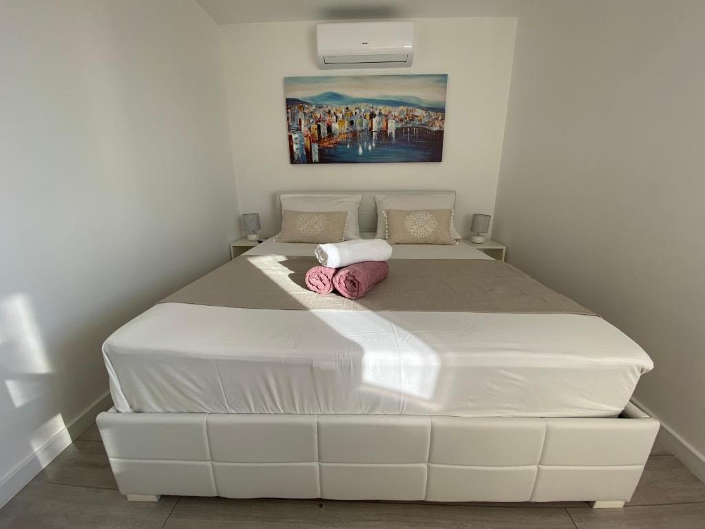 Posteľ alebo postele v izbe v ubytovaní Apartmani Vujić- Villa Dolac