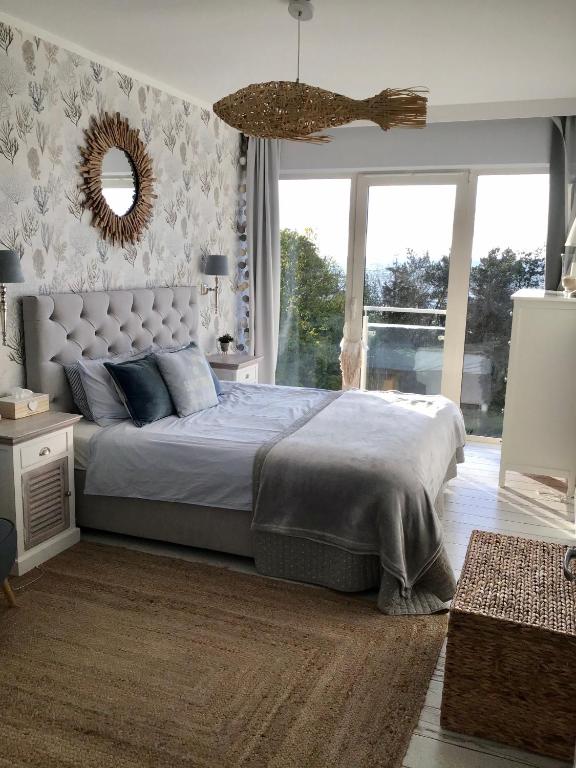 Postel nebo postele na pokoji v ubytování Biały Apartament Hampton w Playa Baltis
