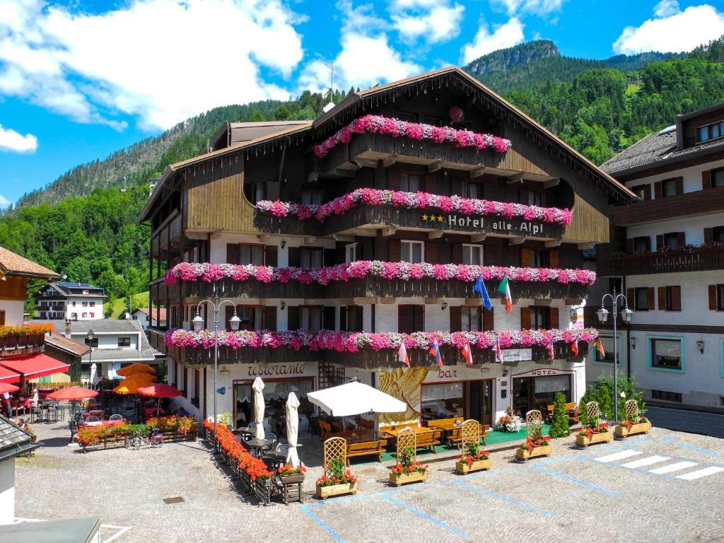 a large building with a bunch of decorations on top of it at Hotel Alle Alpi in Alleghe