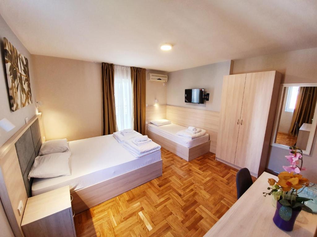 Postel nebo postele na pokoji v ubytování Apartments Pier