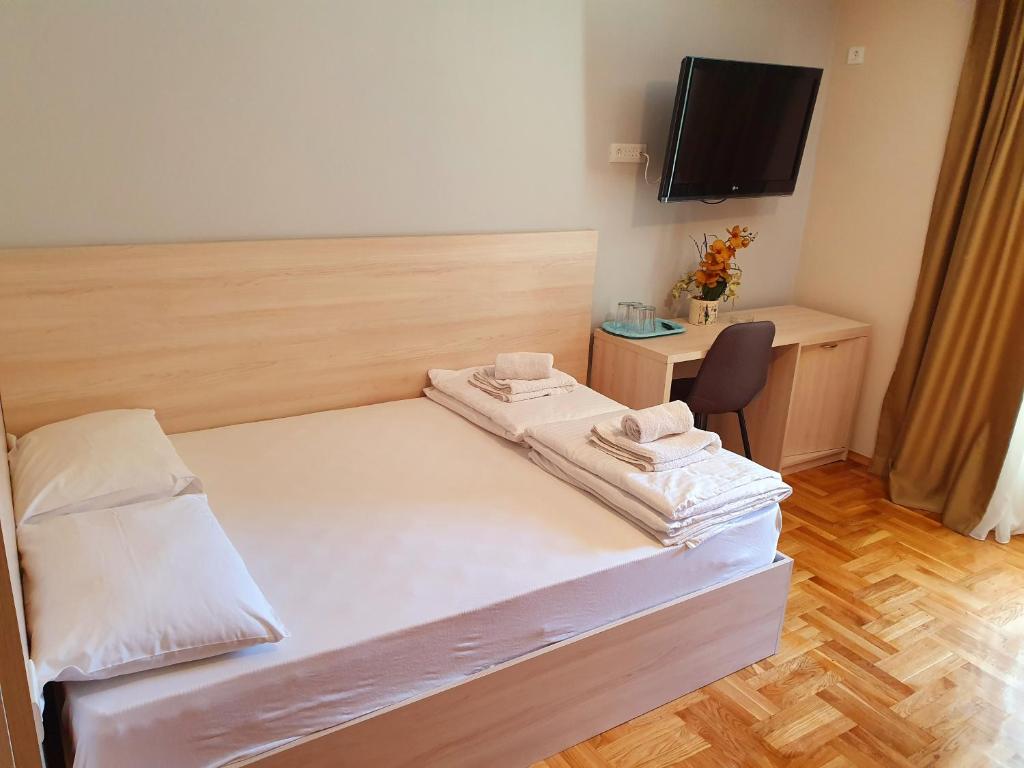 Postel nebo postele na pokoji v ubytování Apartments Pier