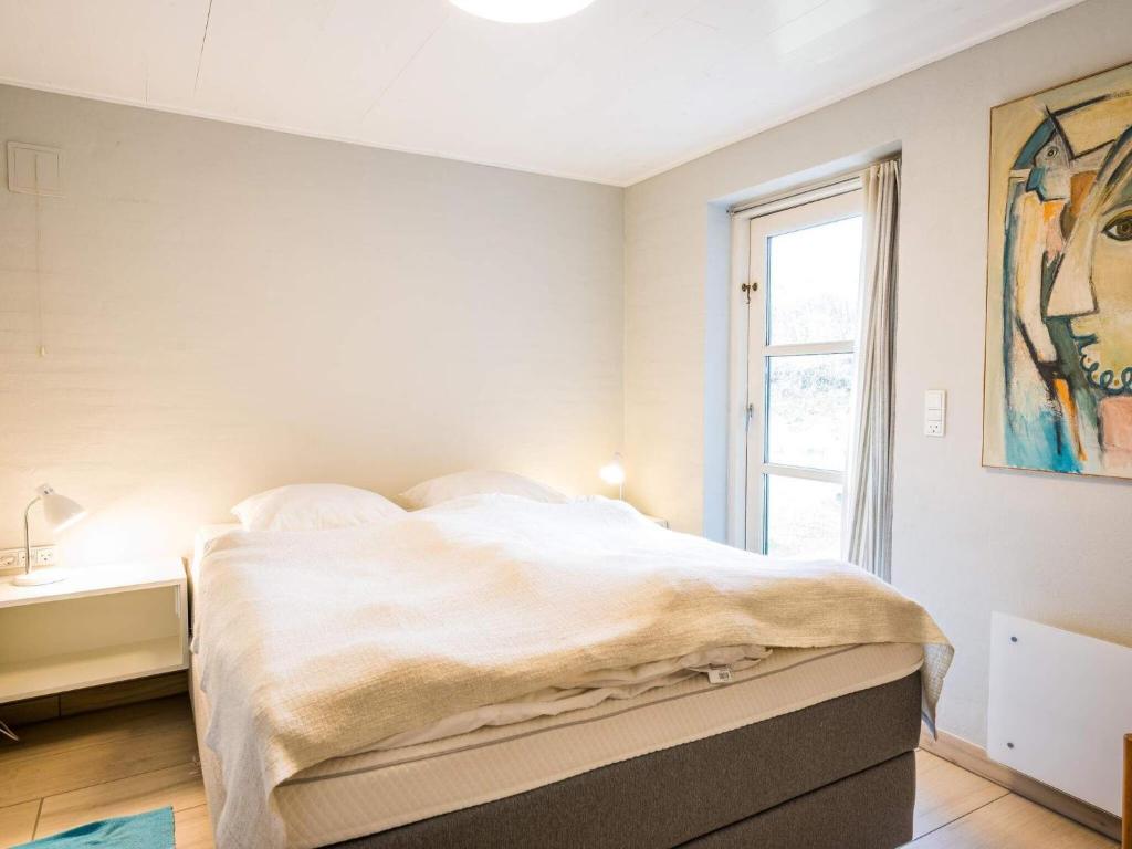 Postel nebo postele na pokoji v ubytování Holiday home Henne XIII