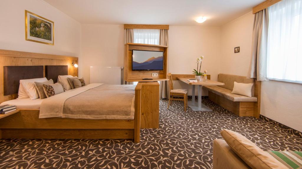 Postel nebo postele na pokoji v ubytování Pension Appartements Gabriele