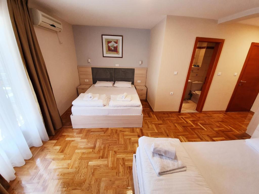 Postel nebo postele na pokoji v ubytování Apartments Pier