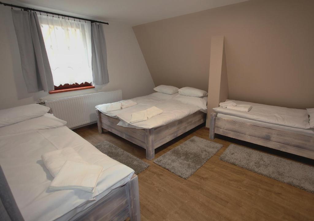 Postel nebo postele na pokoji v ubytování Ubytování pod Rozhlednou