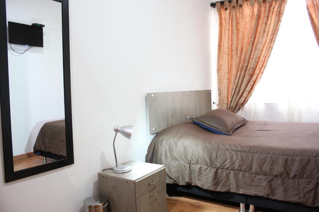 Postel nebo postele na pokoji v ubytování Hospedaje Sary House