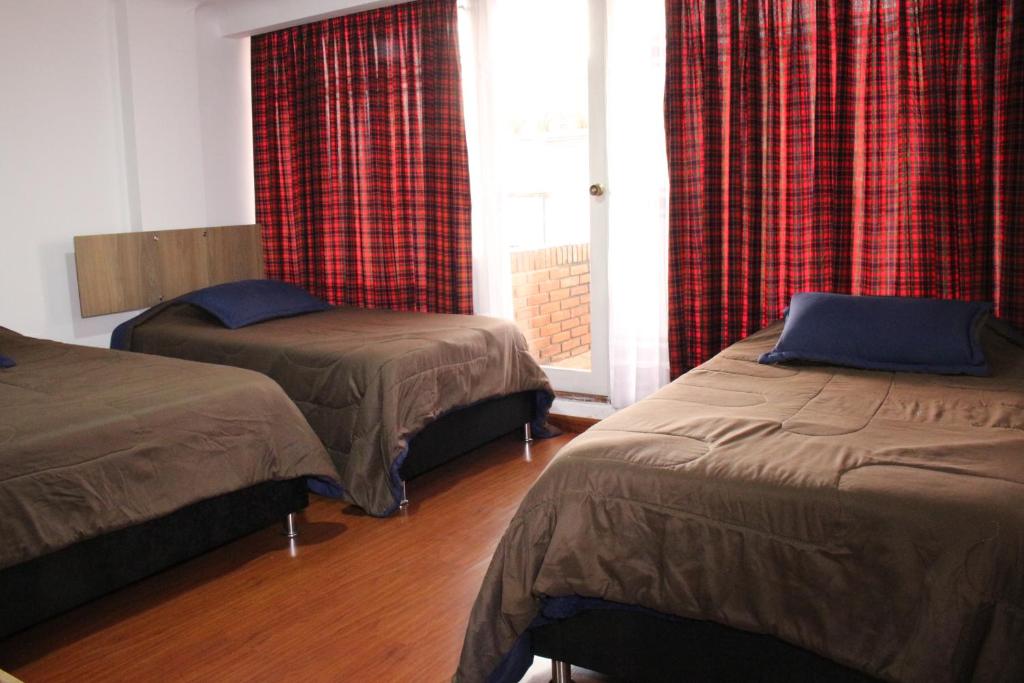 Postel nebo postele na pokoji v ubytování Hospedaje Sary House