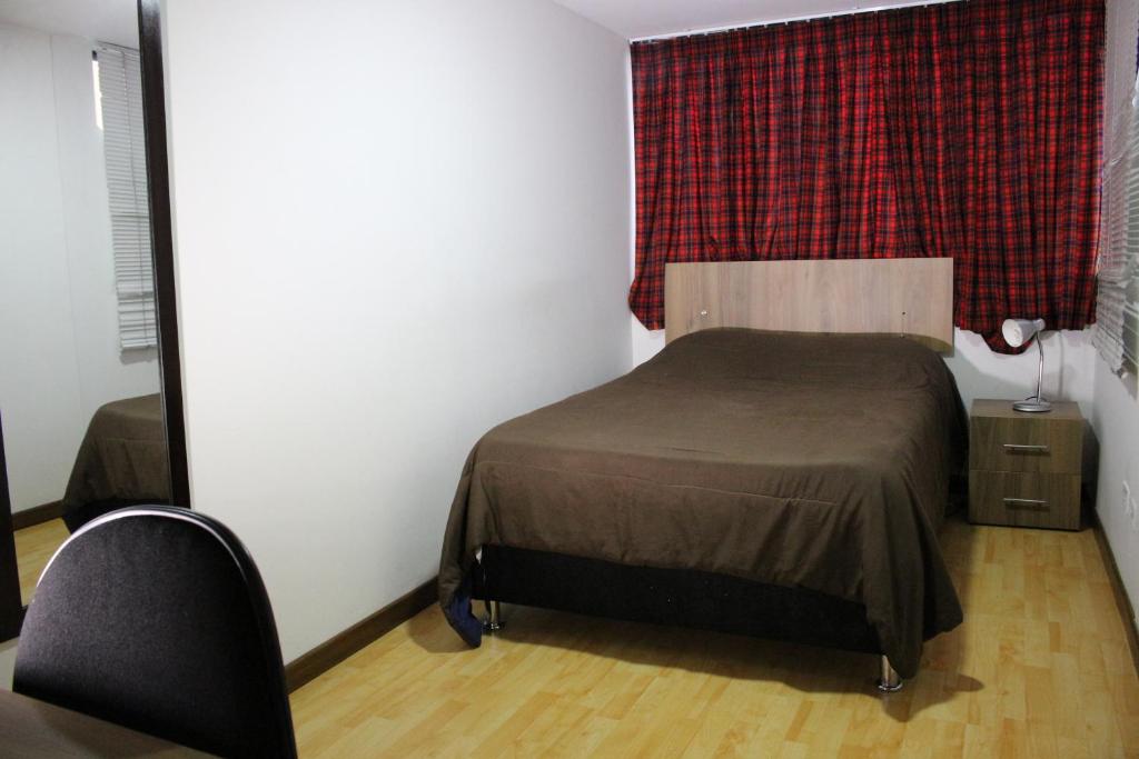 Postel nebo postele na pokoji v ubytování Hospedaje Sary House