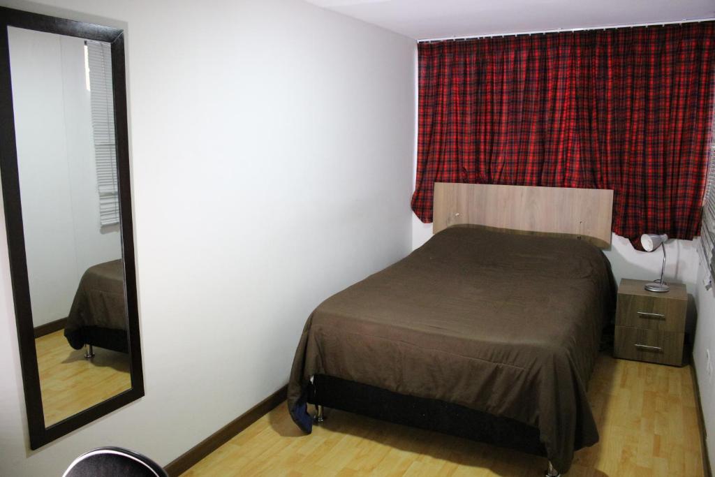 Postel nebo postele na pokoji v ubytování Hospedaje Sary House
