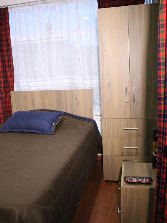Postel nebo postele na pokoji v ubytování Hospedaje Sary House