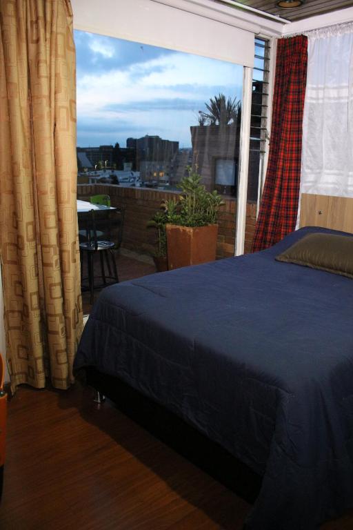 Postel nebo postele na pokoji v ubytování Hospedaje Sary House
