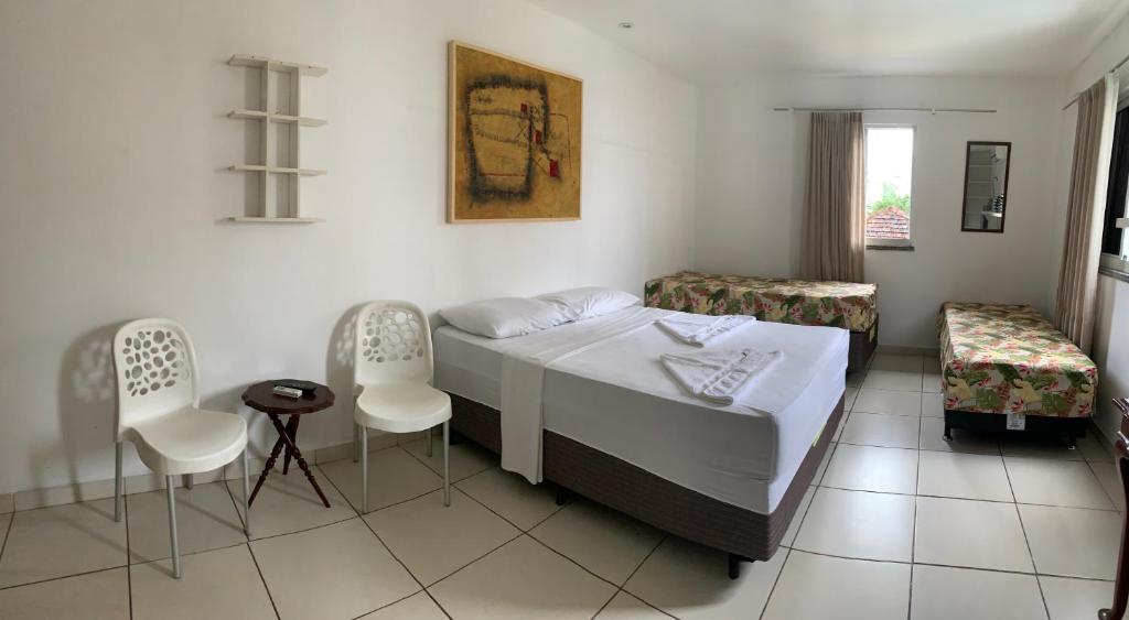 Postel nebo postele na pokoji v ubytování Porto das Palmeiras Hostel