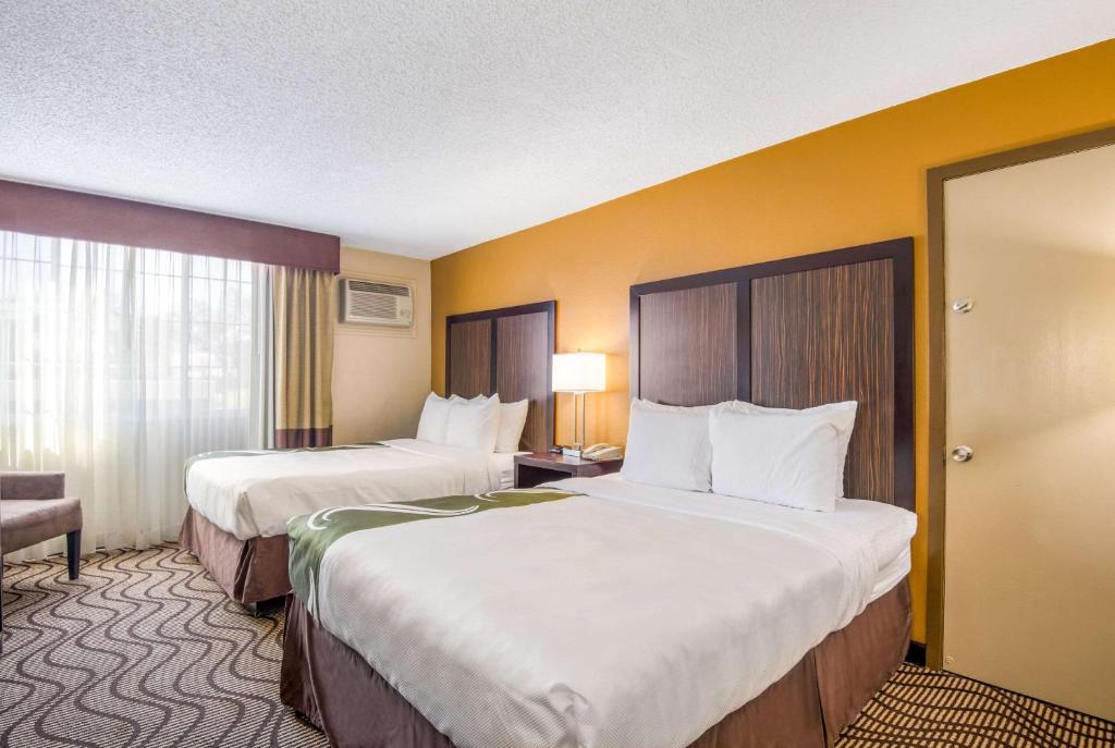 Postel nebo postele na pokoji v ubytování Quality Inn