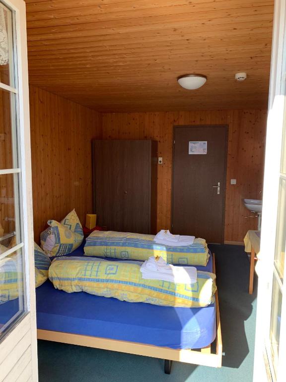 Postel nebo postele na pokoji v ubytování Fischers Lodge