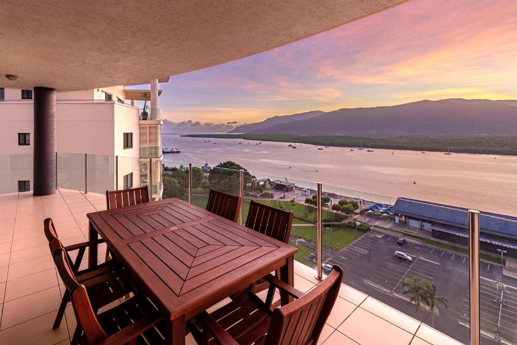 a dining room with a view of the ocean at Piermonde Apartments Cairns in Cairns