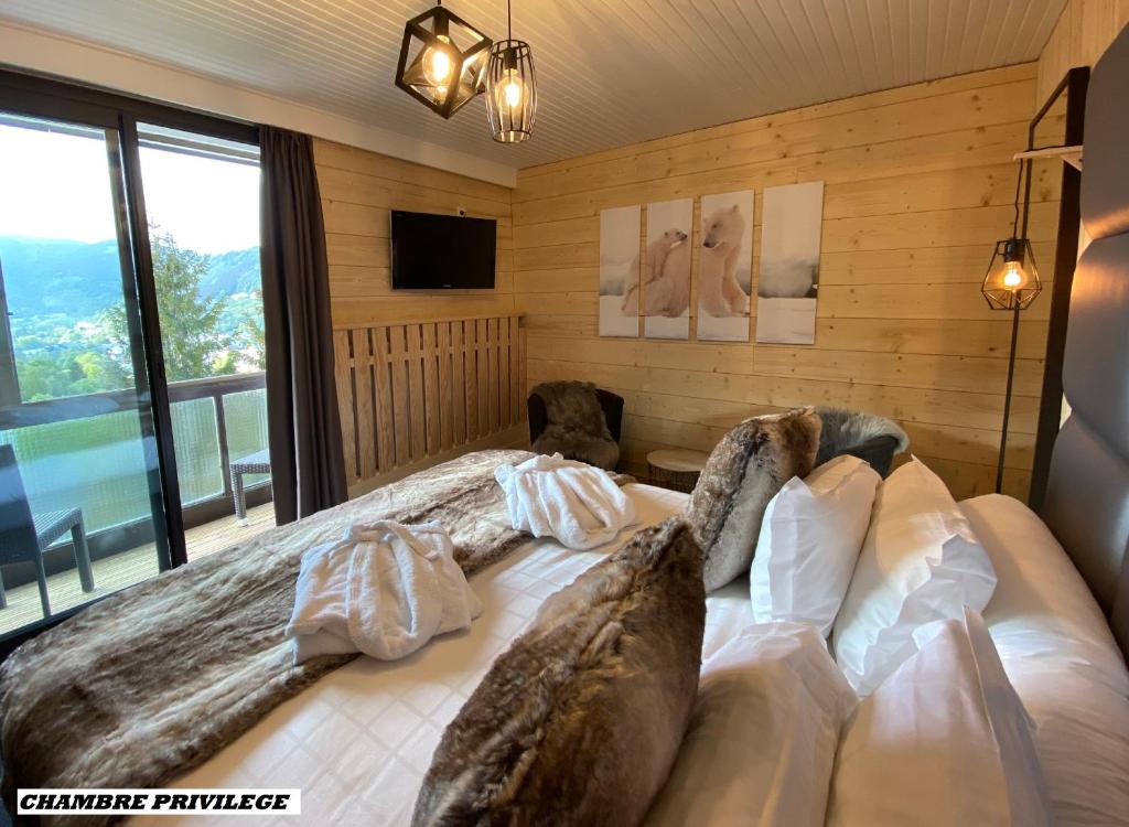 Postel nebo postele na pokoji v ubytování Hotel Le Panorama