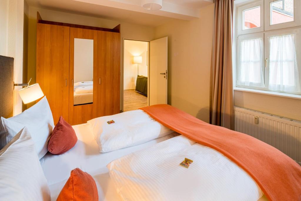 Postel nebo postele na pokoji v ubytování Best Western Hotel Schlossmühle Quedlinburg