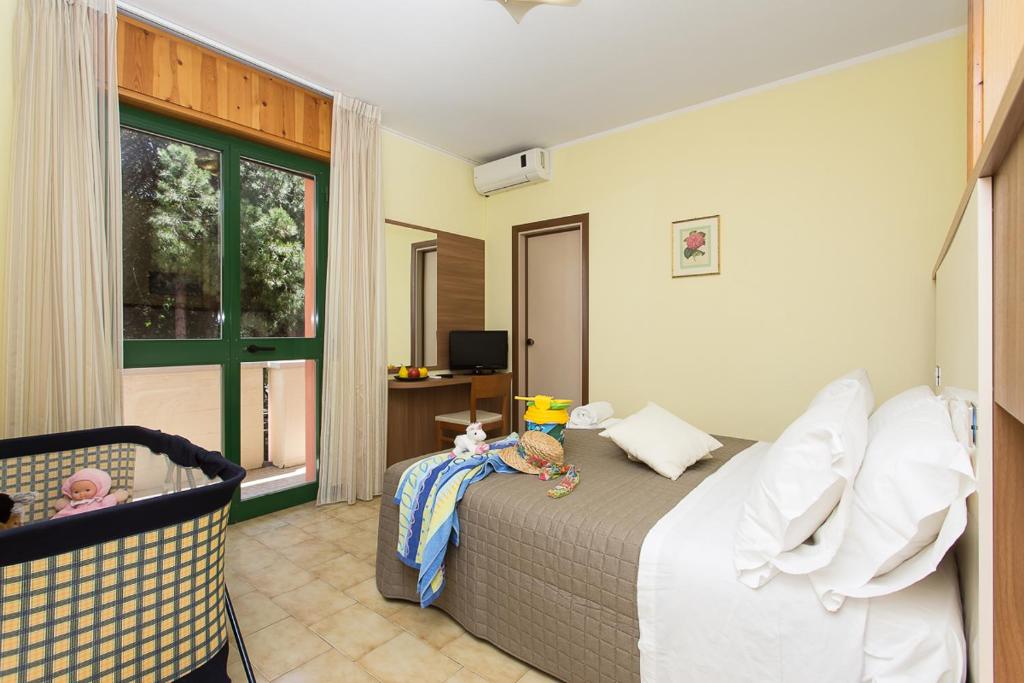 Postel nebo postele na pokoji v ubytování Hotel Valentino